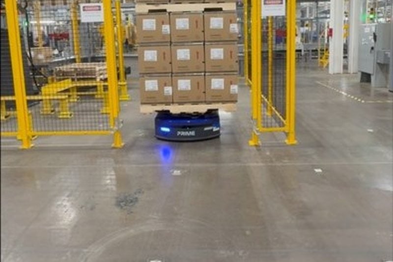 Prime MobilePallet AMR navigating a safety gate zone on a factory floor